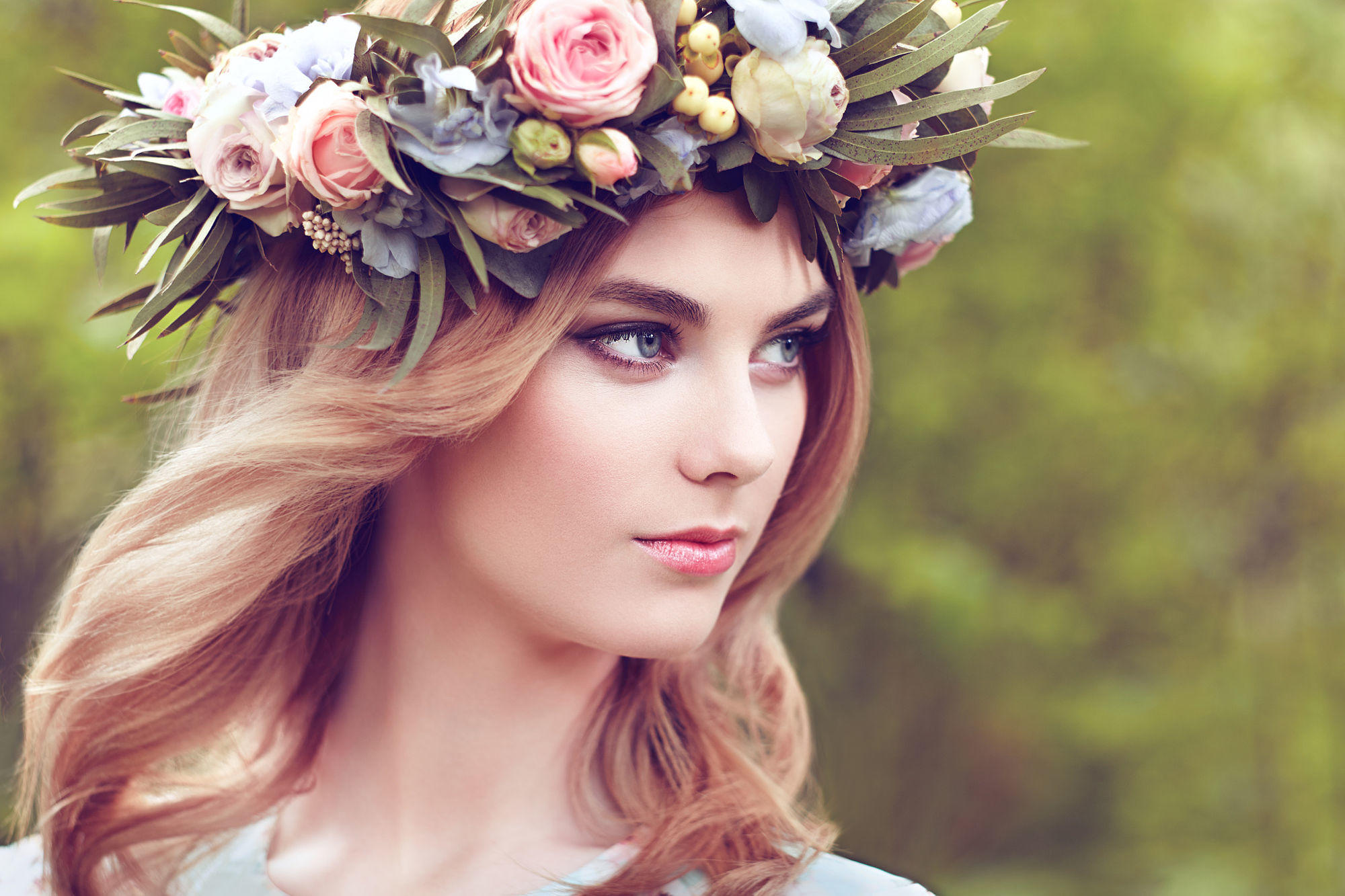 Beautiful blonde woman with flower wreath on her head