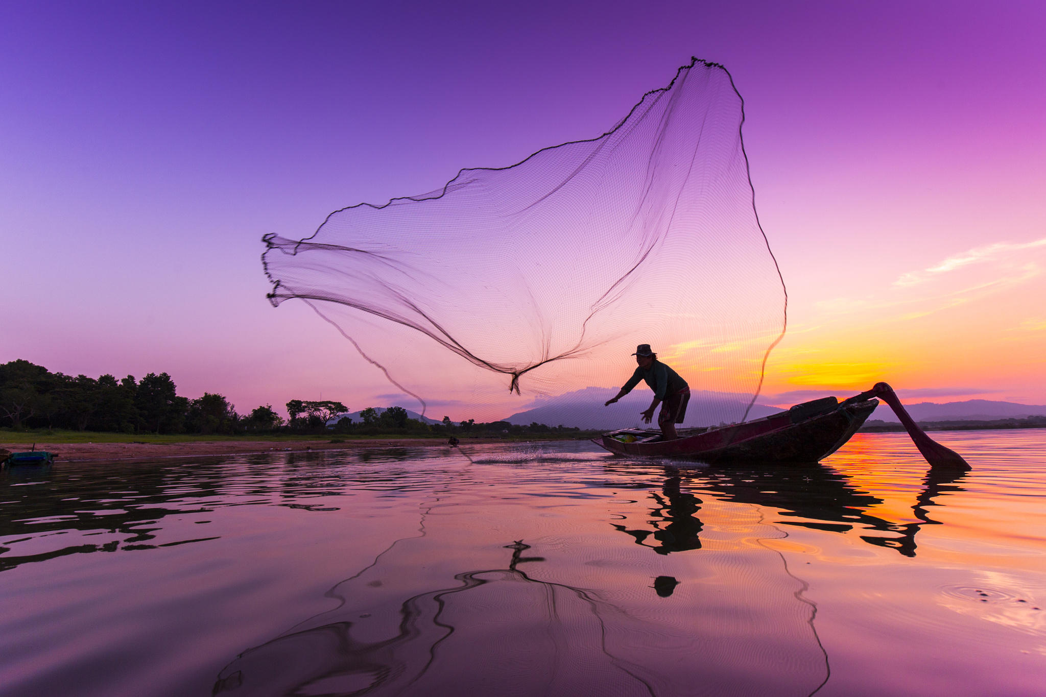 Fisherman at Bangpra Lake, thailand