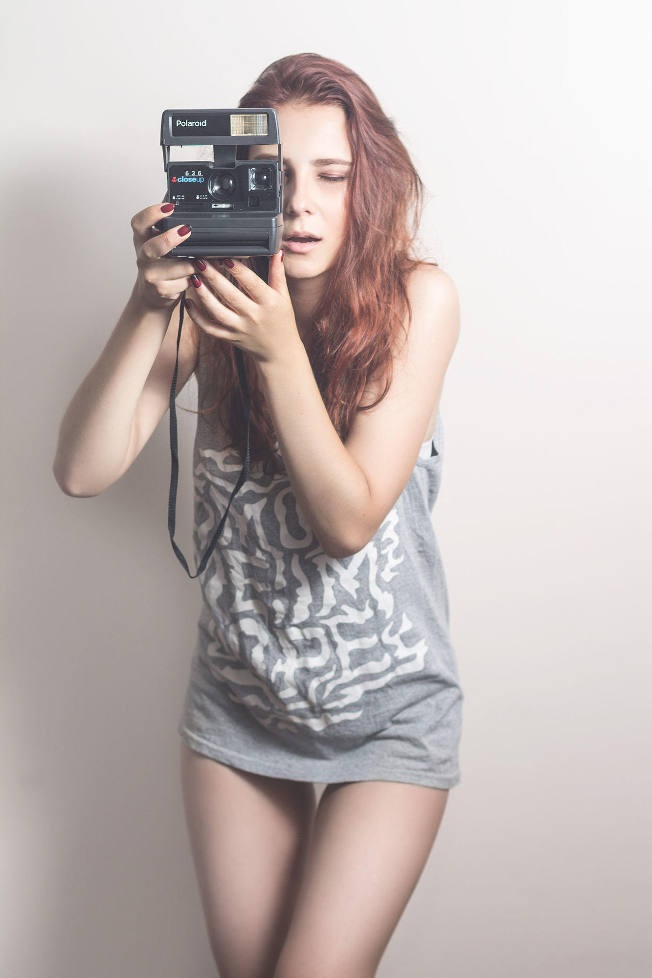 Young cheerful girl with a camera