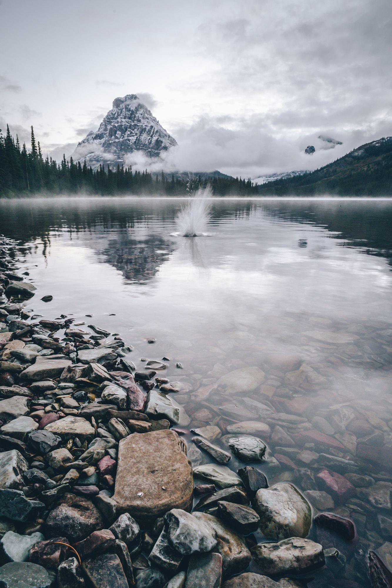 Playing with rocks at two medecine lake