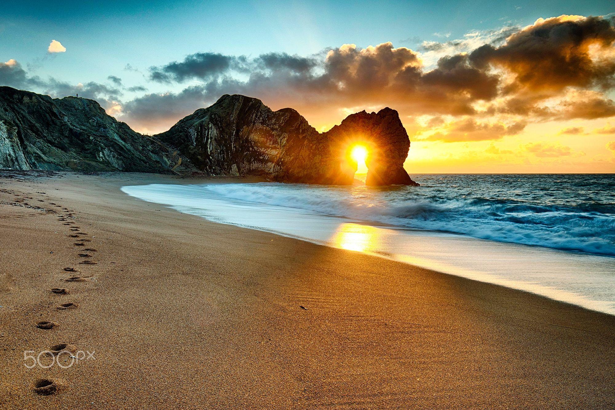 Sunrise Through The Arch